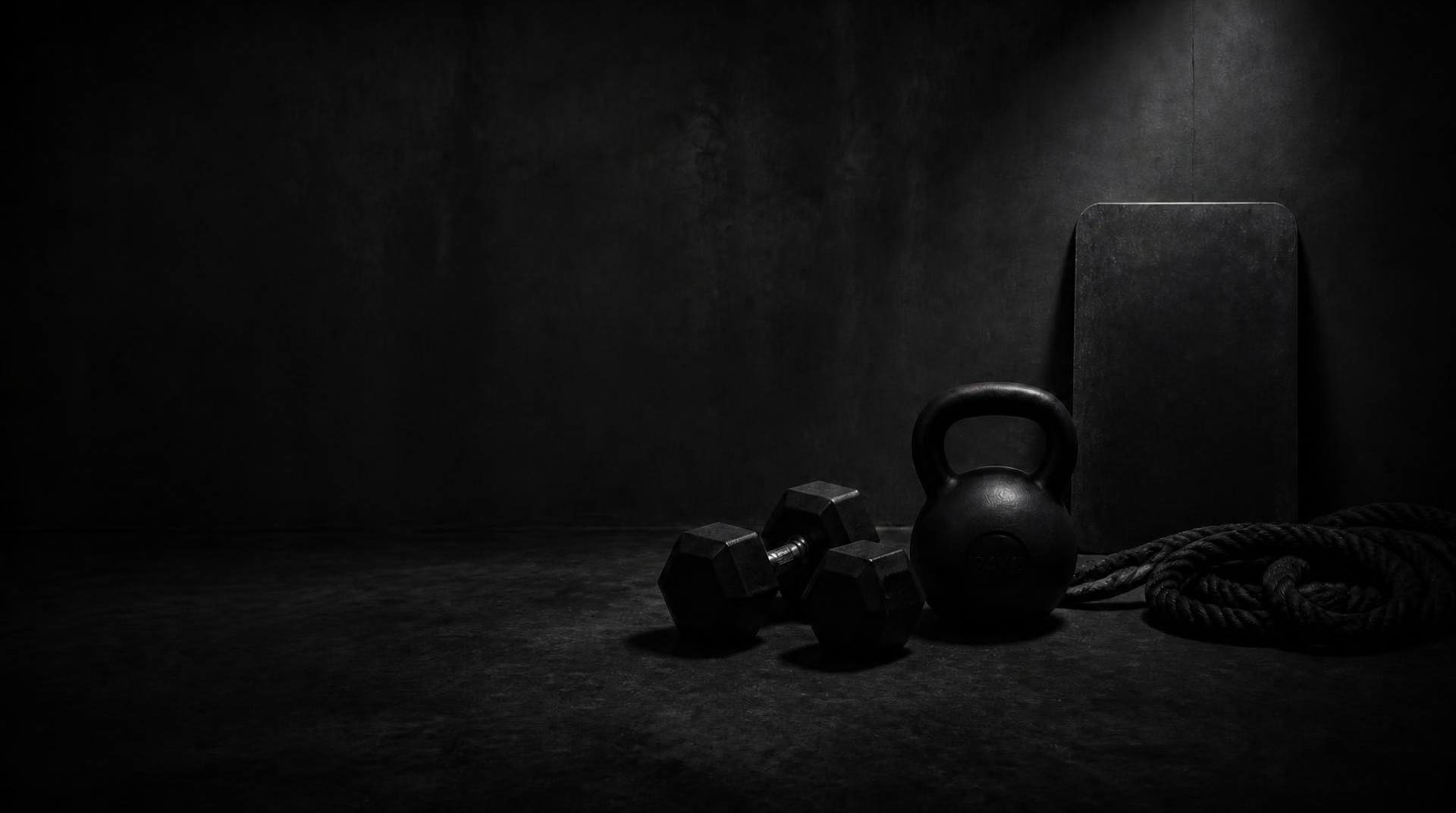 Kettlebell and dumbbells on a gym floor